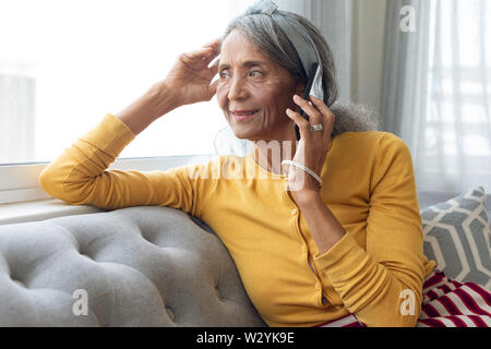 Woman talking on the phone Stock Photo