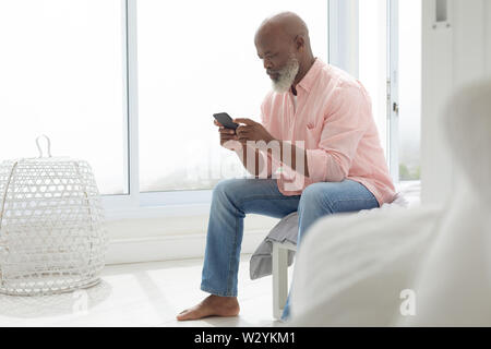 African american Man using smartphone Stock Photo