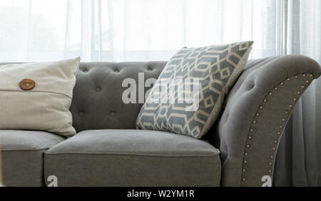 Grey couch with throw pillows Stock Photo