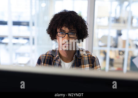 Male graphic designer working on computer Stock Photo
