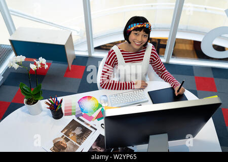 Female Graphic designer using graphic tablet Stock Photo