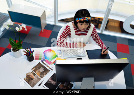 Female graphic designer using graphic tablet Stock Photo