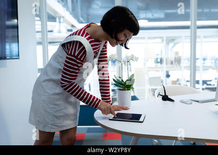 Female executive using digital tablet Stock Photo