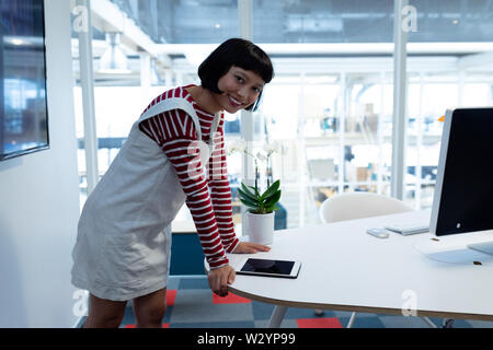 Female executive using digital tablet Stock Photo