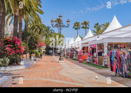 One of the main pretty squares in Ayamonte, Spain during the summer when there are stores selling clothes, sweets and souvenirs. Stock Photo