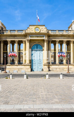 Front view of the southern entrance of the Palais Bourbon, seat of the French National Assembly in Paris, France, decked with french flags. Stock Photo