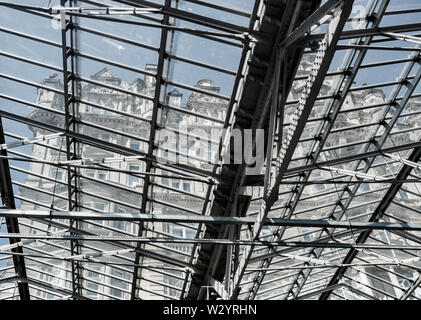 The Balmoral Hotel, formerly The North British Hotel seen through the roof of Waverley railway station in Edinburgh, Scotland. UK Stock Photo