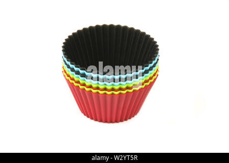 Set of clolorful silicon moulds for muffins over white Stock Photo