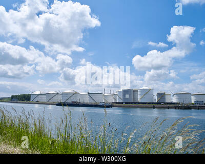 View on oil storage tanks in industrial area along the Caland canal near Rotterdam Stock Photo