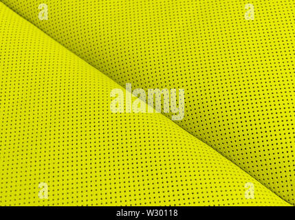Modern luxury Car yellow leather interior.  Part of perforated leather car seat details. Yellow Perforated leather texture background. Texture, artifi Stock Photo