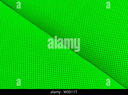 Modern luxury Car green leather interior.  Part of perforated leather car seat details. Green Perforated leather texture background. Texture, artifici Stock Photo