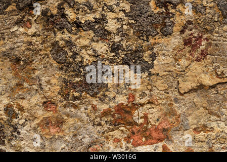 Close up of the mottled surface pattern and texture of handmade bricks. Stock Photo