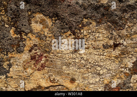 Close up of the mottled surface pattern and texture of handmade bricks. Stock Photo