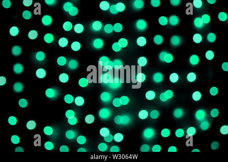 Unfocused abstract colourful bokeh black background. defocused and blurred many round blue light.