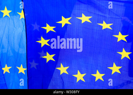 EU European Union flags with the ring of yellow stars, close up Stock Photo