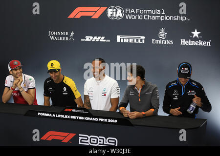 Silverstone, Northampton, UK. 11th July 2019. F1 Grand Prix of Great Britain, Driver arrivals day; Alfa Romeo Racing, Antonio Giovinazzi, Renault Sport F1 Team, Daniel Ricciardo, Mercedes AMG Petronas Motorsport, Lewis Hamilton, McLaren, Lando Norris and ROKiT Williams Racing, George Russell during driver press conference Credit: Action Plus Sports Images/Alamy Live News Stock Photo