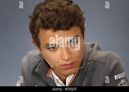 McLaren driver Lando Norris of Britain reacts during a press conference ...