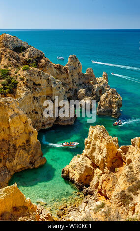 A small inlet near Lagos, the Algarve, with tourist boat trips Stock Photo