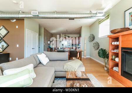 Studio condominium or apartment interior showing dining and kitchen areas from living room. Stock Photo