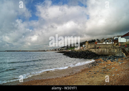 UK,Dorset,Lyme Regis,Church Beach and Gun Cliff Walk with Harbour and Seafront in background