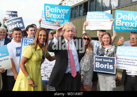 Conservative Party leadership candidate Boris Johnson arriving with Maidstone and The Weald MP Helen Grant (left) for the Tory leadership in Maidstone, Kent. Stock Photo