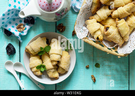 Homemade cookies with dried prunes and walnuts on a rustic wooden table. Top view flat lay. Stock Photo