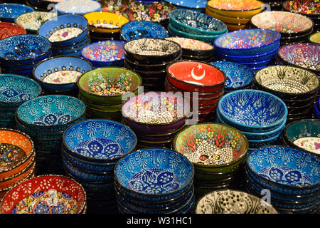 Painted beautiful dishes on the counter. Plates with patterns. Stock Photo