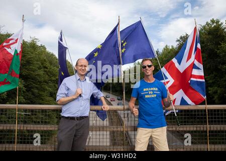 Cardiff, Wales, UK, July 11th 2019. Anti-Brexit protesters deliver their message to passing motorists during the evening rush hour at Culverhouse Cross, a major road artery into and out of the city. Credit: Mark Hawkins/Alamy Live News Stock Photo