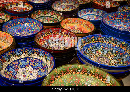 Painted beautiful dishes on the counter. Plates with patterns. Stock Photo
