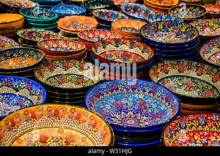 Painted beautiful dishes on the counter. Plates with patterns. Stock Photo