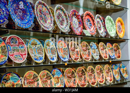 Painted beautiful dishes on the counter. Plates with patterns. Stock Photo