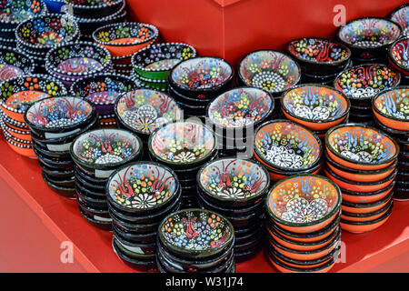 Painted beautiful dishes on the counter. Plates with patterns. Stock Photo