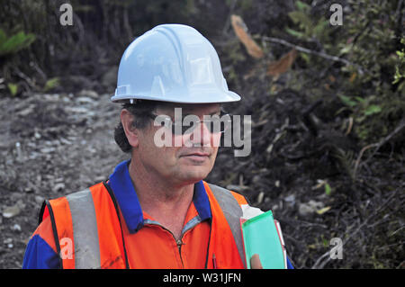 Portrait of a geologist inspecting a seismic line in New Zealand Stock Photo