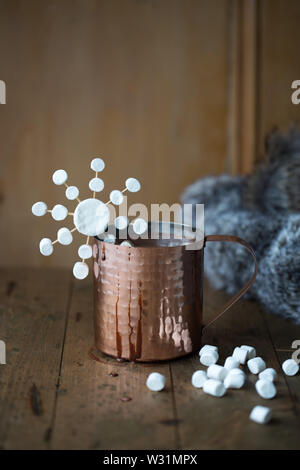 Hot chocolate in a copper mug with marshmallows Stock Photo
