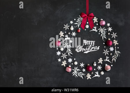 Christmas objects laid out in the shape of a wreath, overhead view Stock Photo