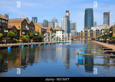 Clippers Quay, looking towards Millwall Outer Dock and Canary Wharf on the Isle of Dogs, east London, UK Stock Photo