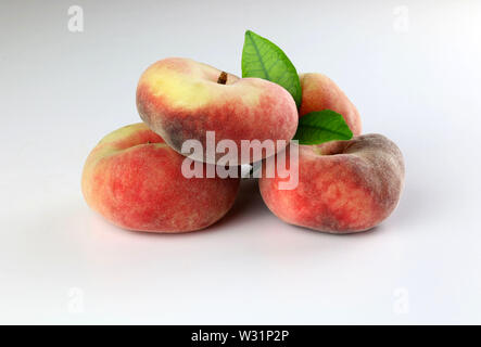 Snuff peaches on a white background Stock Photo