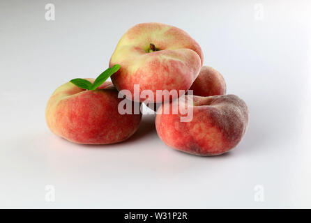 Snuff peaches on a white background Stock Photo