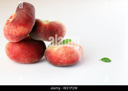 Snuff peaches on a white background Stock Photo