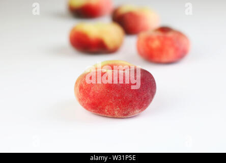 Snuff peaches on a white background Stock Photo