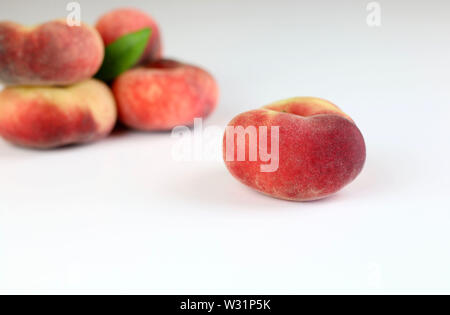 Snuff peaches on a white background Stock Photo