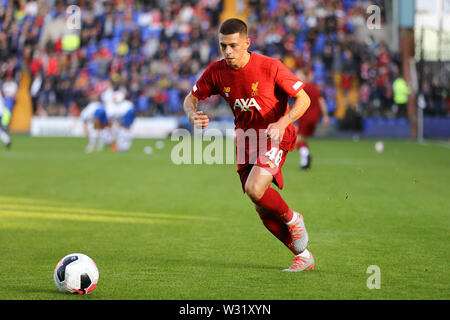 Birkenhead, UK. 11th July, 2019. Adam Lewis of Liverpool warms up at half time. Pre-season football friendly match, Tranmere Rovers v Liverpool at Prenton Park in Birkenhead, The Wirral on Thursday 11th July 2019. this image may only be used for Editorial purposes. Editorial use only, license required for commercial use. No use in betting, games or a single club/league/player publications. pic by Chris Stading/Andrew Orchard sports photography/Alamy Live news Credit: Andrew Orchard sports photography/Alamy Live News Stock Photo