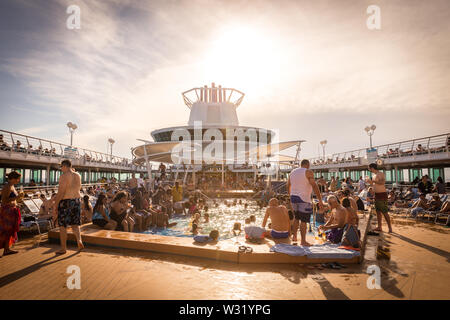 NASSAU, BAHAMAS - SEPTEMBER, 08, 2014: People having fun in pool on Royal Caribbean's ship, Majesty of the Seas, sails in the Port of the Bahamas on S Stock Photo