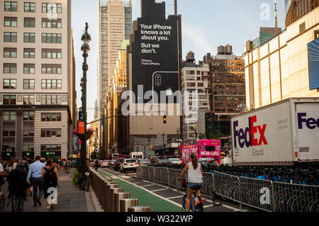 A billboard on the side of a building in Midtown Manhattan on Tuesday, July 9, 2019 informs viewers of the privacy afforded by using Apple devices.  (© Richard B. Levine) Stock Photo