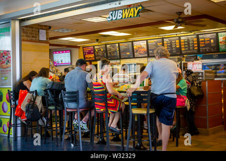 Diners crowd a franchise of the Subway sandwich chain in the Staten Island Ferry Terminal in New York on Saturday, July 6, 2019. (© Richard B. Levine) Stock Photo