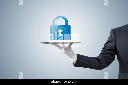 Businessman offering computer security on silver tray Stock Photo