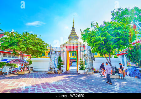 BANGKOK, THAILAND - APRIL 22, 2019: Sum Pratu Song Mongkut are the entrance gates of Wat Pho Temple, decorated with two chinese guardians, on April 22 Stock Photo