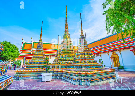 BANGKOK, THAILAND - APRIL 22, 2019: The group of five chedis on the single foundation in Wat Pho temple contain the relics of Lord Buddha, on April 22 Stock Photo