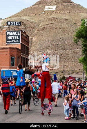 Woman on stilts; Salida Circus School; annual Fourth of July Parade; small mountain town of Salida; Colorado; USA Stock Photo
