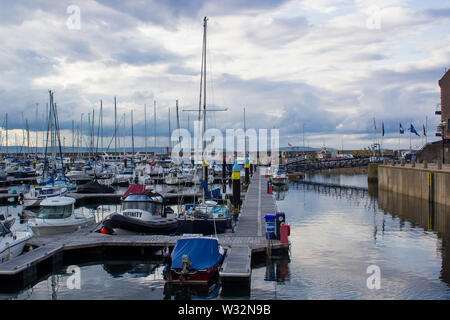 11 July 2019 Boats moored in the modern marina in Bangor County Down Northern Ireland on a balmy summer's evening as dusk falls. Stock Photo